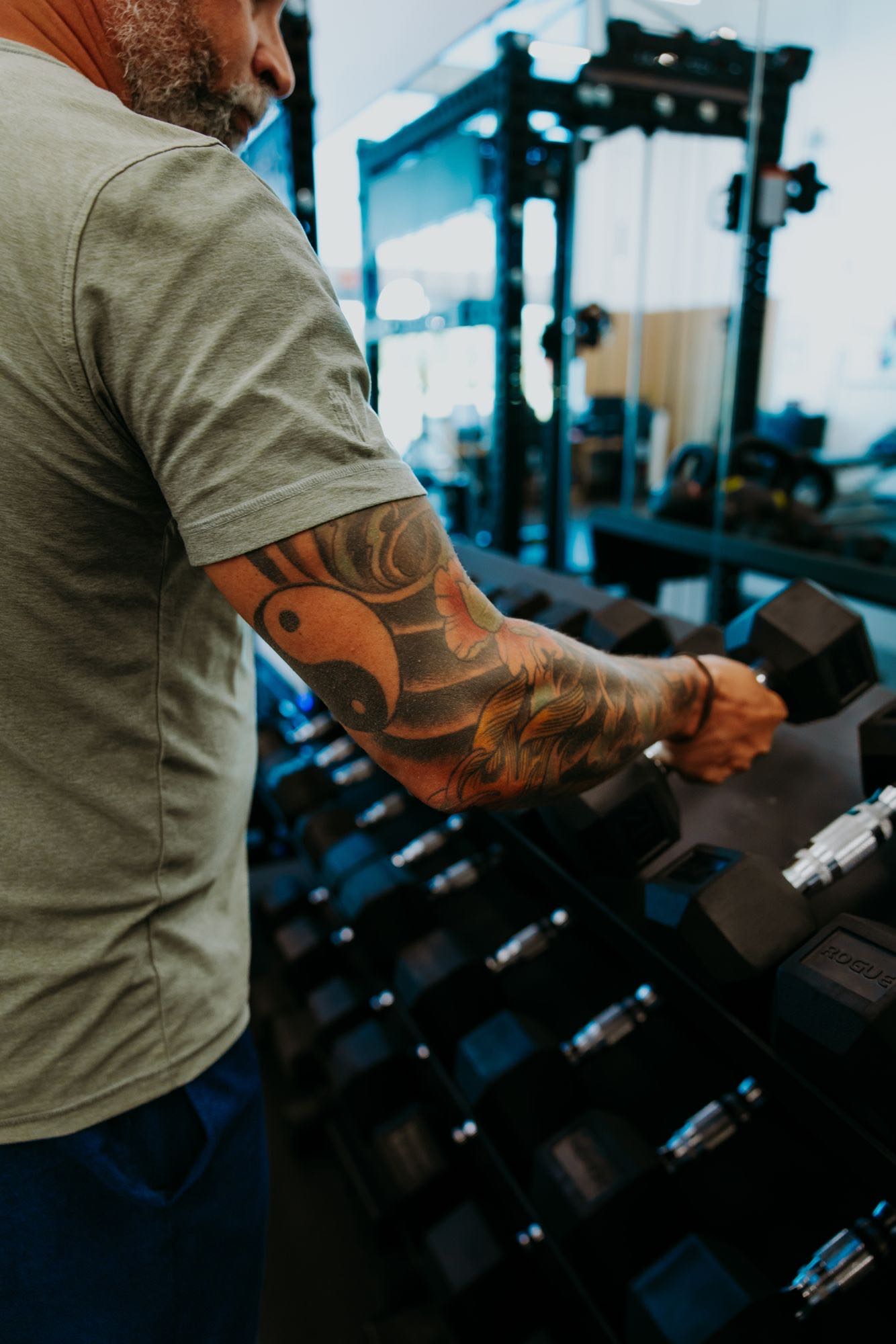 Jason lifting weights in the gym