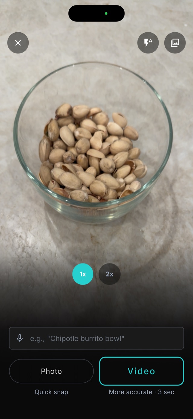 Pointing the camera at a bowl of food, with photo and 3-second video capture options